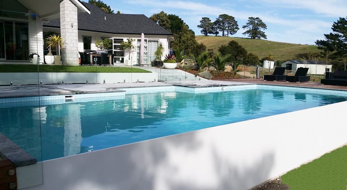 Precision infinity edge pool showcasing expert engineering and breathtaking Auckland views